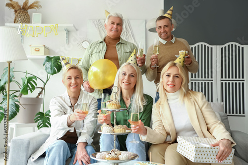 Mature people celebrating B...