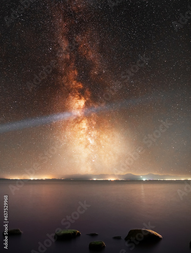 Beautiful night landscape, bright Milky Way galaxy on the lake. © Inga Av