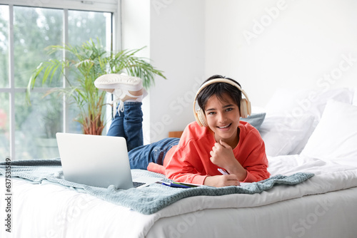 Little boy with headphones ...