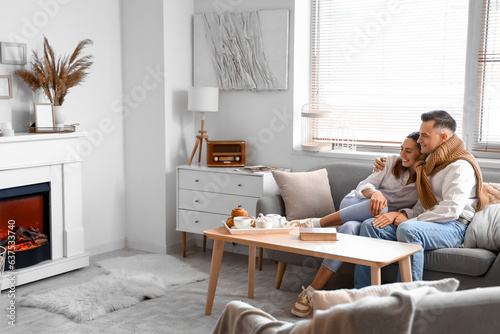 Young couple sitting on sof...