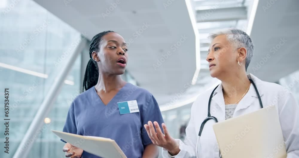 Documents, teamwork of doctor and nurse walking in hospital lobby, mentor and student discussion. Collaboration, folder and people, surgeon and medical professional in healthcare, planning or talking