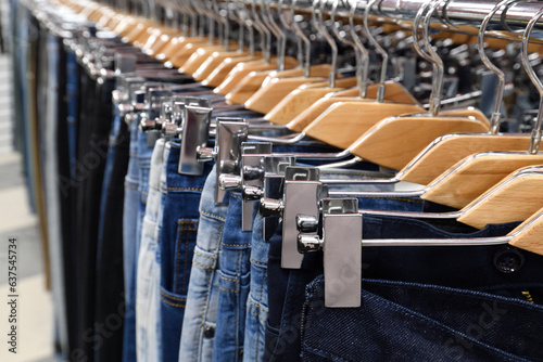 Jeans hanging on a hanger in a store