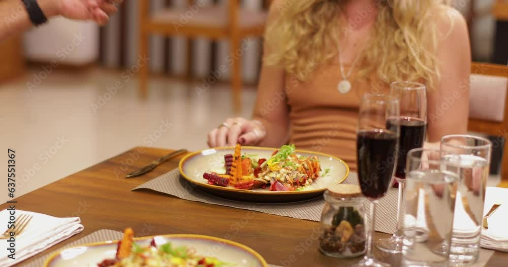 Serving The Food to a blond lady in a fancy restaurant Serving The Food to a blond lady in a fancy restaurant