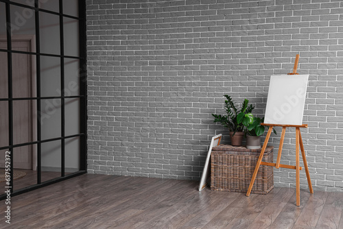 Wooden easel with blank can...