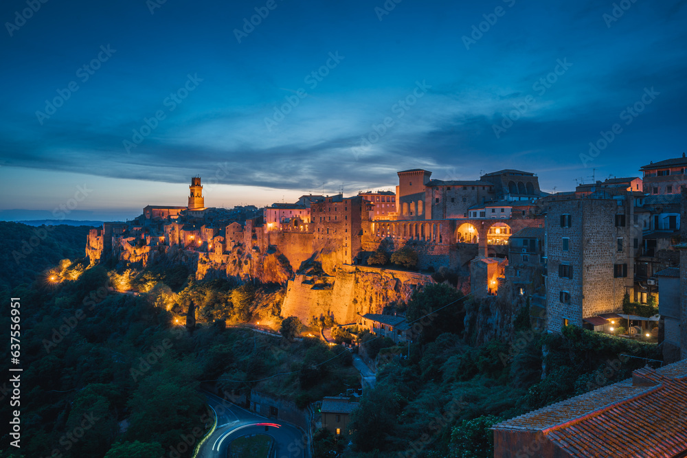 Italian medieval city at sunset, Pitigliano in the province of Grosseto in southern Tuscany, Italy