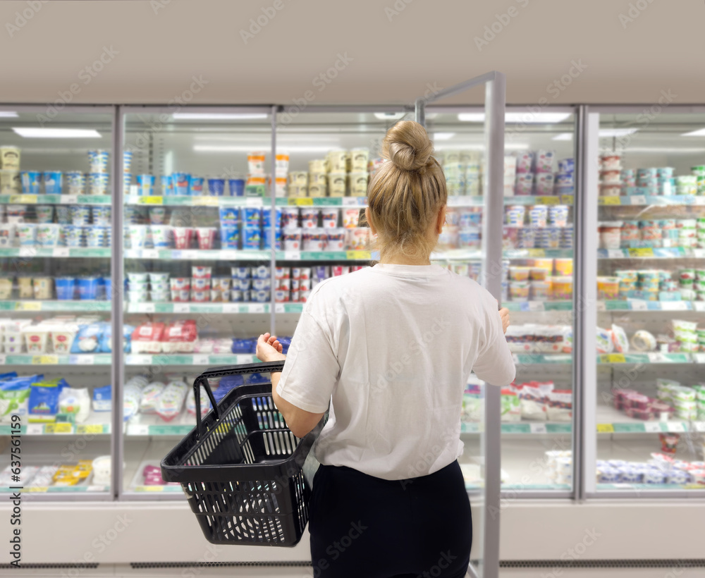 choosing a dairy products at supermarket.various goods on the supermarket shelves