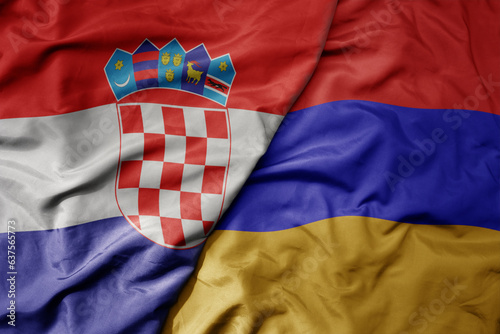 big waving national colorful flag of croatia and national flag of armenia .