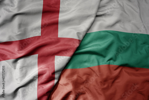 big waving national colorful flag of england and national flag of bulgaria .