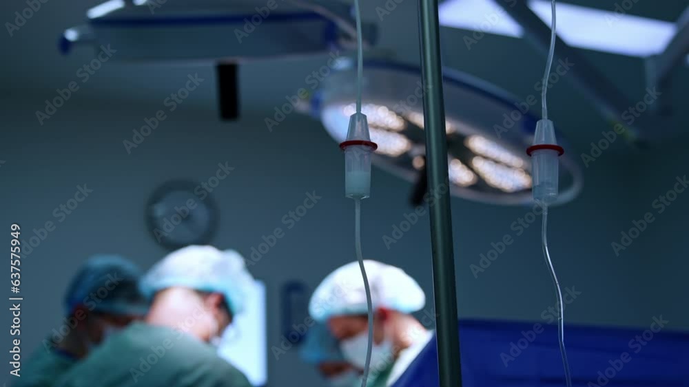 Two reservoirs of drop counters with medicines dripping inside. Doctors ...