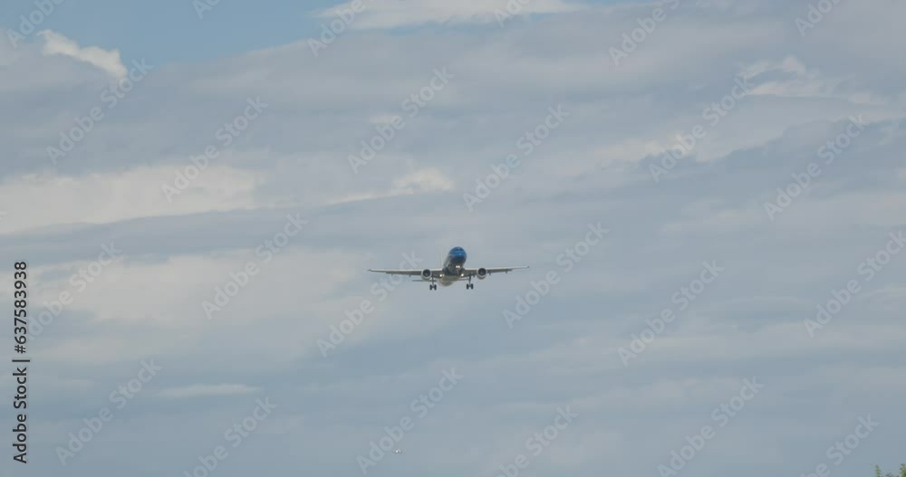 A plane flying over a lush green forest A plane flying over a lush green forest