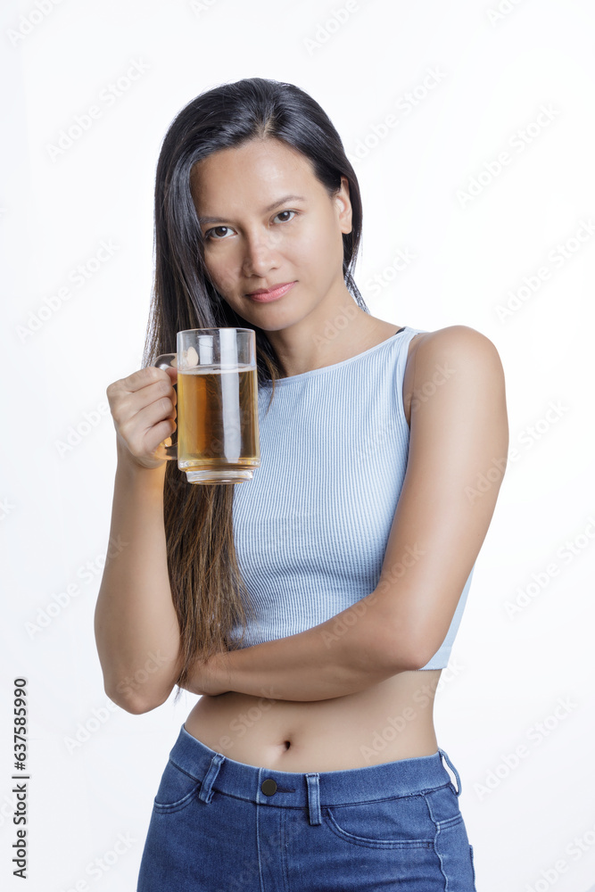 Asian American celebrating while holding a mug of delicious beer Asian American celebrating while holding a mug of delicious beer