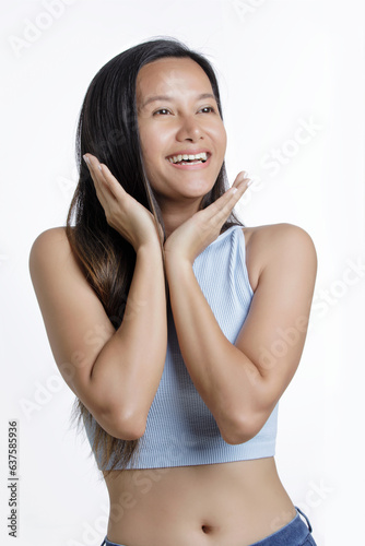 Asian American Woman showing emotions of happyness  isolated on a white background with copy space photo