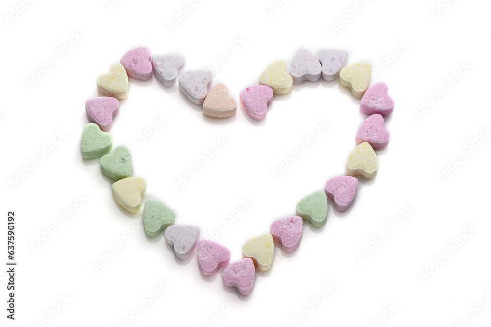 multi-colored heart-shaped candies laid out in the shape of a heart multi-colored heart-shaped candies laid out in the shape of a heart