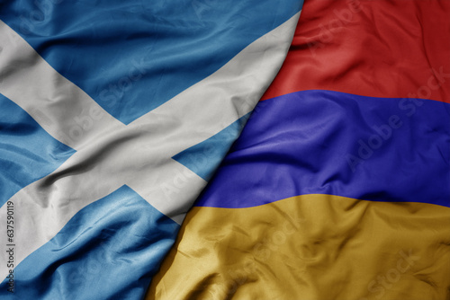 big waving national colorful flag of scotland and national flag of armenia .