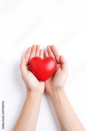 girls hands holding red heart on white background. top view. health, support and love. taking care of your health.