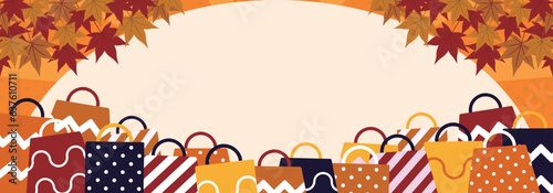 紅葉に飾られ、ショッピングバッグに囲まれた秋の広告バナーテンプレート（黄色）　Autumn ad　banner template decorated with autumn leaves and surrounded by shopping bags (yellow)