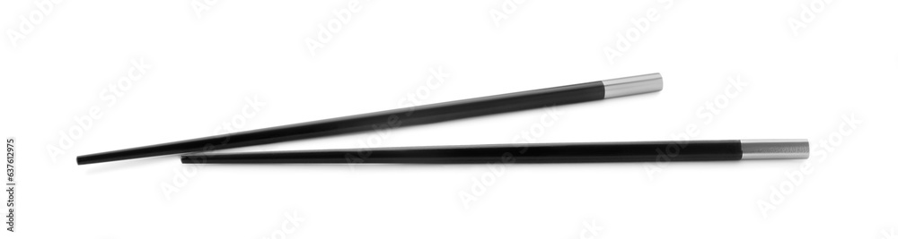 Pair of black chopsticks isolated on white