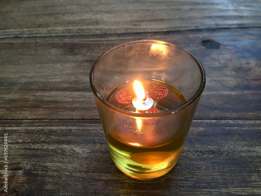 candle with cooking oil fuel in a glass, serves to repel flies Stock
