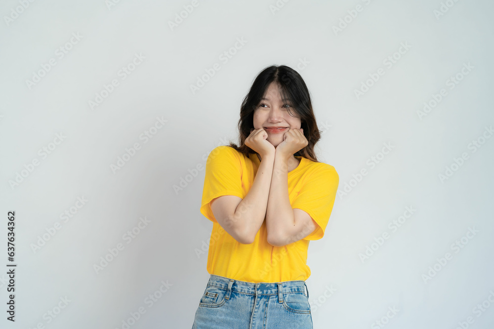Positive Asian woman thinking creative choice on white background Smiling girl thinking about questions some brooding expressions Positive Asian woman thinking creative choice on white background Smiling girl thinking about questions some brooding expressions