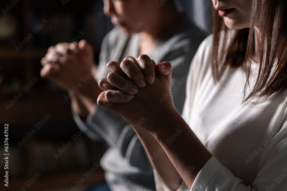 Group of different women praying together, Christians and Bible study concept.