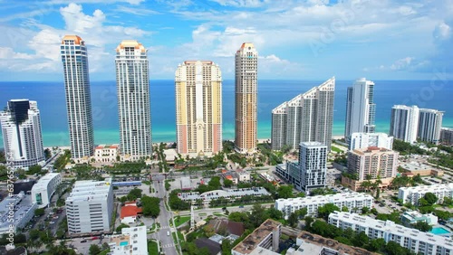 Sunny Isles Beach Florida. Panorama of Miami Beach FL. Atlantic Ocean beach. Beautiful seascape. Turquoise color of sea water. Summer vacation in Florida. Aerial view on Hotels and Resorts on Island