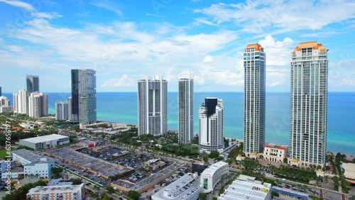 Sunny Isles Beach Florida. Panorama of Miami Beach FL. Atlantic Ocean beach. Beautiful seascape. Turquoise color of sea water. Summer vacation in Florida. Aerial view on Hotels and Resorts on Island