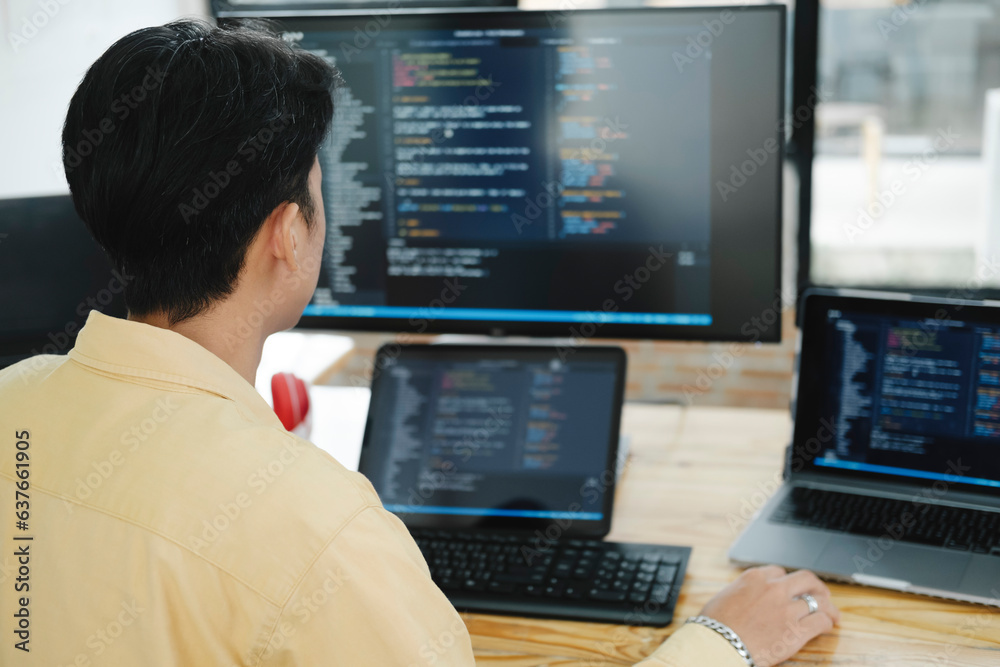 IT Programmer Starts Working on Desktop Computer. IT Programmer Starts Working on Desktop Computer.