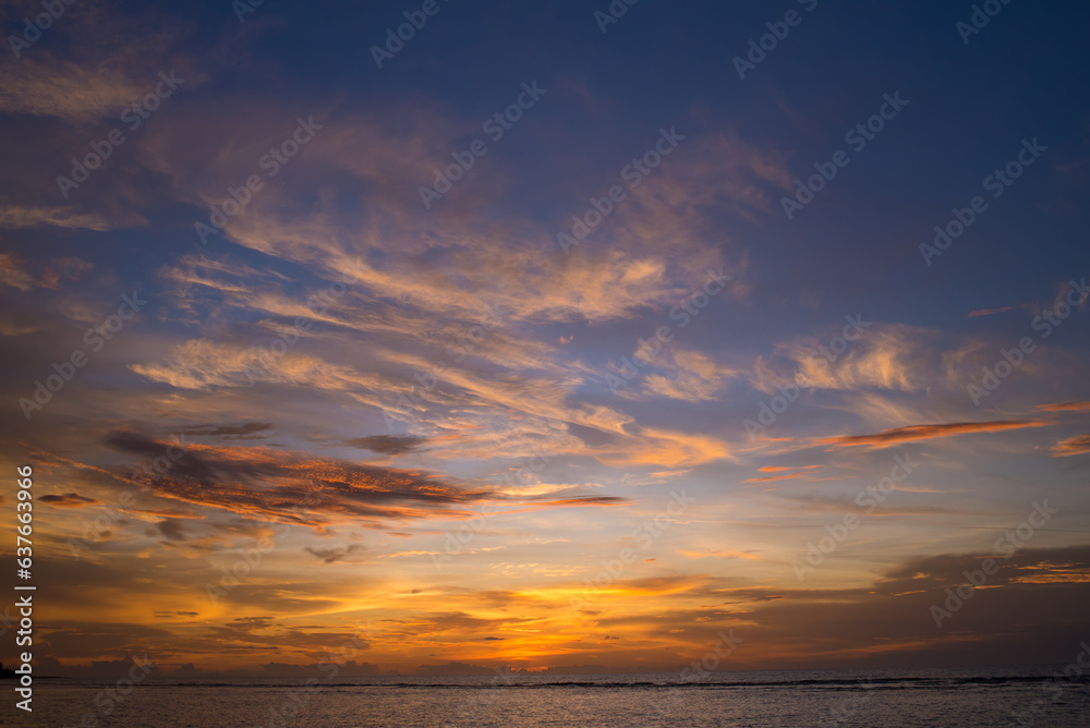 The colorful sky at sunset and the reflection in the sea look amazing. Nature beautiful Light Sunset or sunrise over sea.Real amazing panoramic sunrise or sunset sky with gentle colorful clouds.