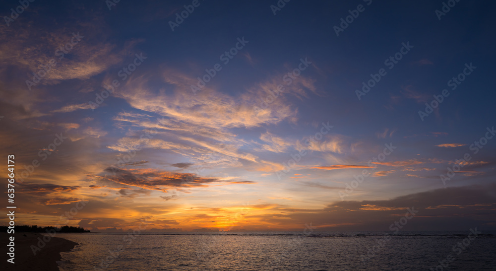 The colorful sky at sunset and the reflection in the sea look amazing. Nature beautiful Light Sunset or sunrise over sea.Real amazing panoramic sunrise or sunset sky with gentle colorful clouds.