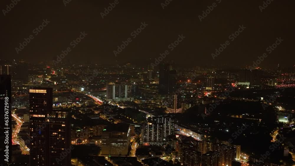 Kuala Lumpur, Malaysia - September 11, 2022: Aerial view of night illumination in Kuala Lumpur city with skyscrapers. Kuala Lumpur, Malaysia - September 11, 2022: Aerial view of night illumination in Kuala Lumpur city with skyscrapers.