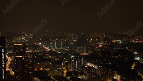 Wallpaper Mural Kuala Lumpur, Malaysia - September 11, 2022: Aerial view of night illumination in Kuala Lumpur city with skyscrapers. Torontodigital.ca