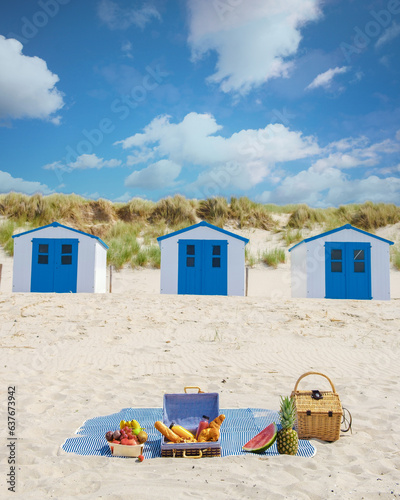 Picnic on the beach Texel Netherlands, beach of Texel with white sand and a colorful beach house and sand dunes