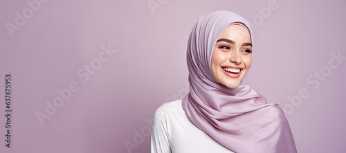 Young Malay Muslim wearing hijab smiling with copy space