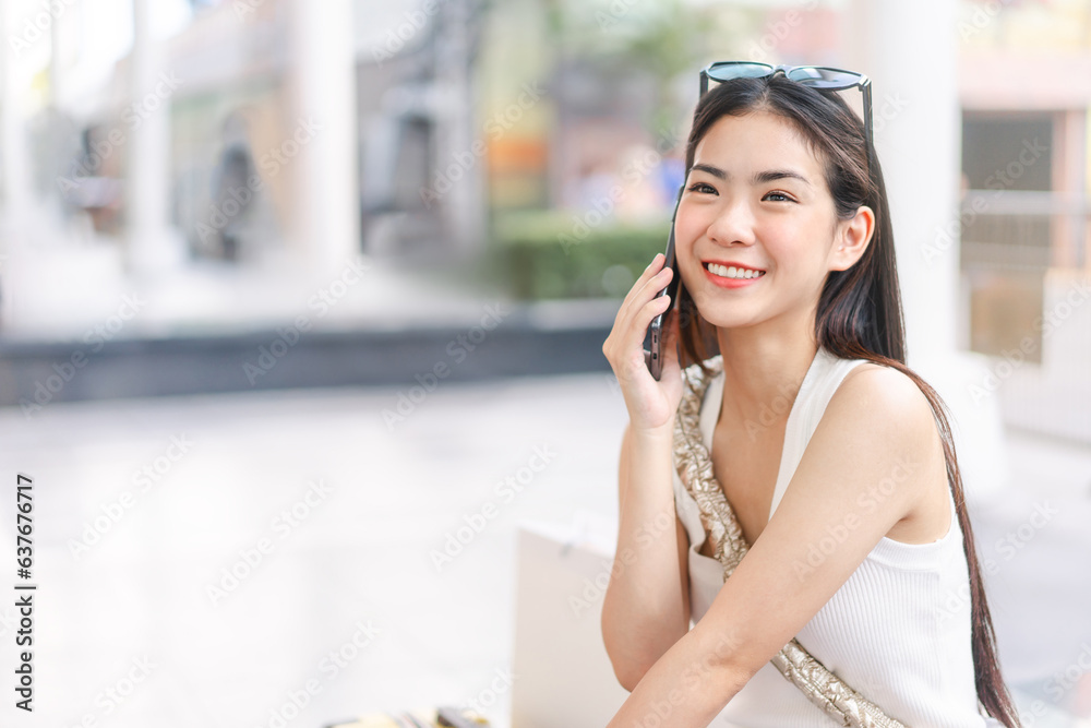 Candid portrait beautiful face asian woman with happy smile using smartphone