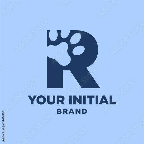 letter R paw print dog foot silhouette in negative space initial vector logo design