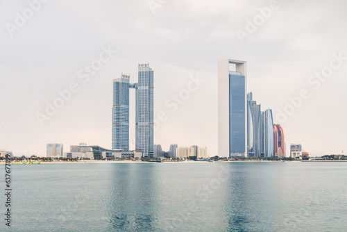 View from territory of Heritable village Abu Dhabi museum to buildings located on opposite side of bay in Abu Dhabi city, United Arab Emirates