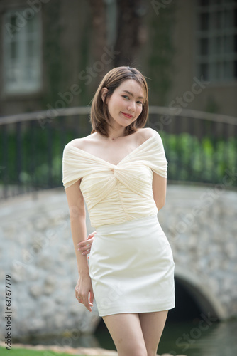 Portrait of young smiling woman looking at camera. happy girl standing in creative office. genuine natural portrait of brunette woman happy and smiling on rooftop of new modern home.