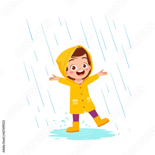 little kid wearing yellow rain coat in the rain and feel happy
