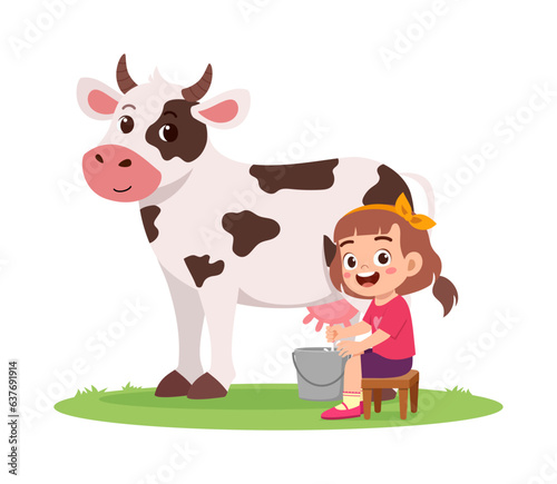 little kid milking cow and feel happy