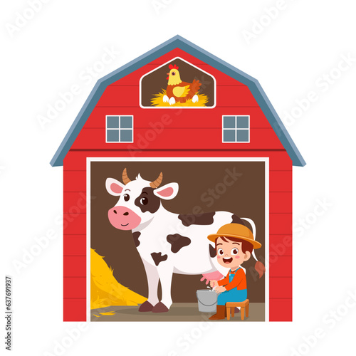 little kid milking cow inside red barn