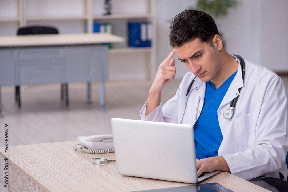 Young male doctor in telemedicine concept