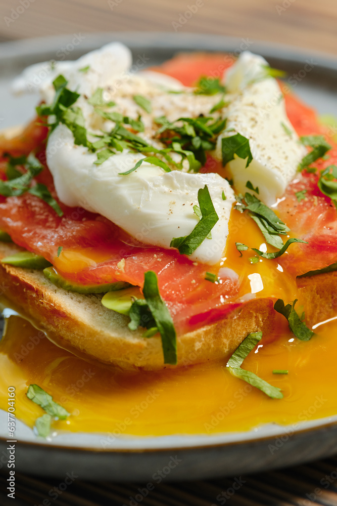 Closeup view of sandwich with smoked salmon and poached egg