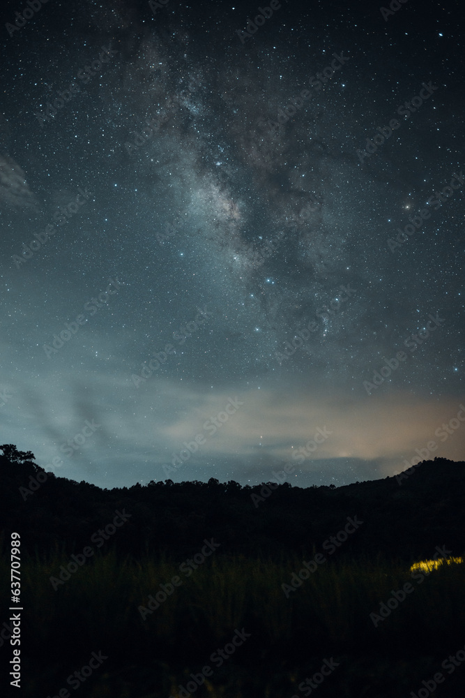 Milky way and bonfire at night