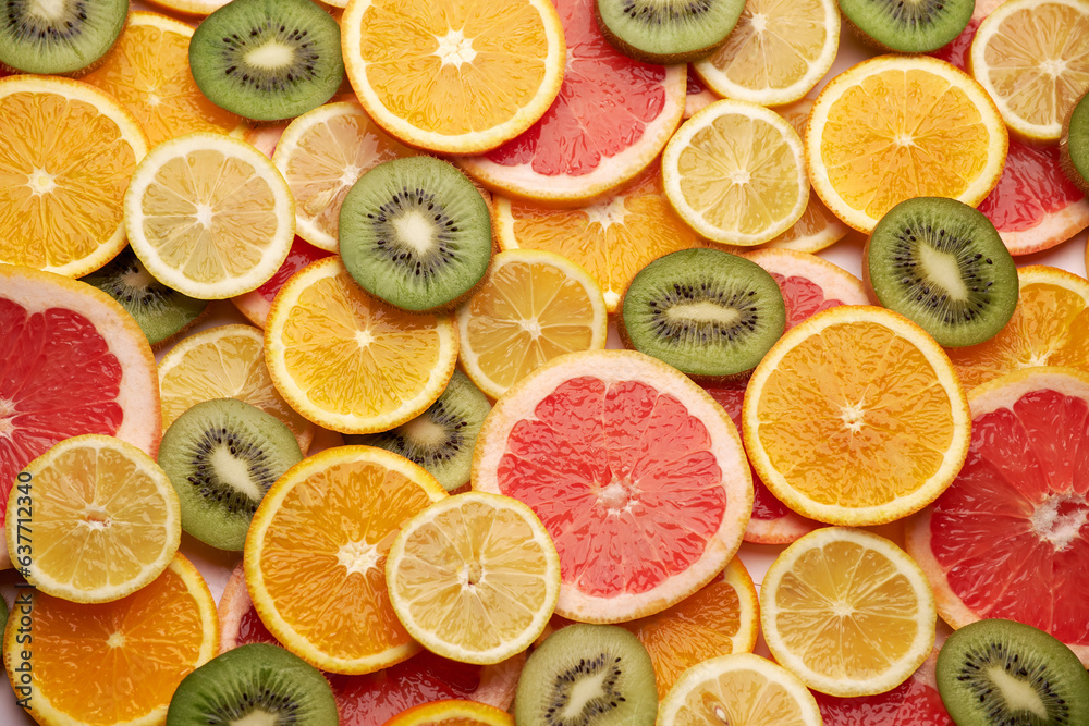 top down background view made of Fresh Sliced organic kiwi, oranges and lemons close-up top down background view made of Fresh Sliced organic kiwi, oranges and lemons close-up