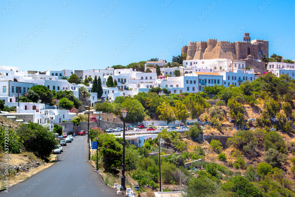 The three windmills of Chora and iconic Monastery of Saint John the Theologian in chora of Patmos island, Dodecanese, Greece