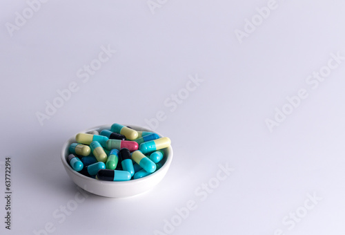 one cup of medicine capsule on white background