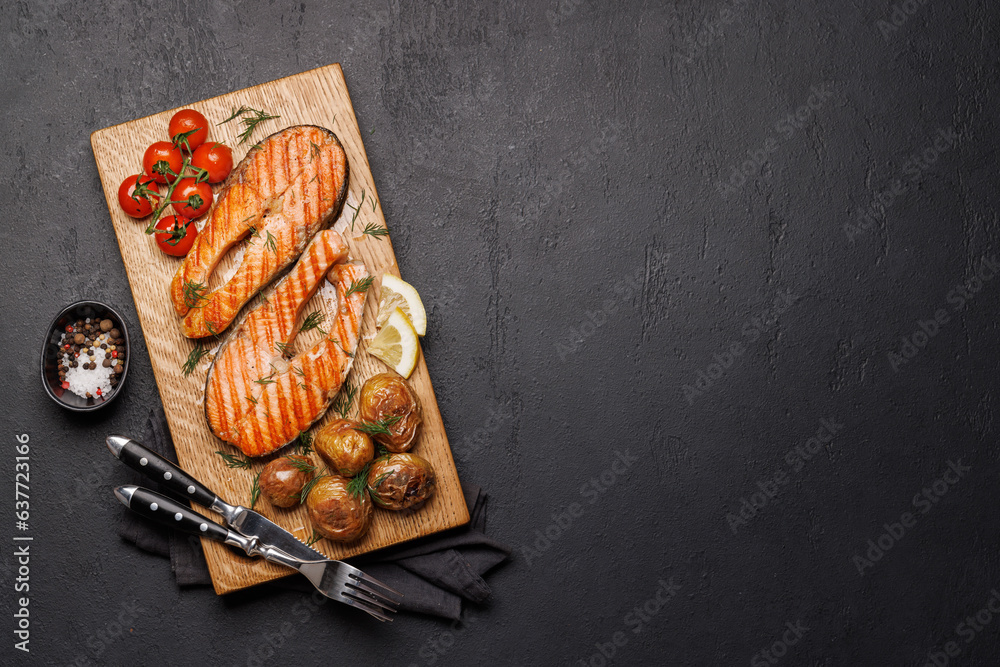 Grilled salmon steaks and potatoes