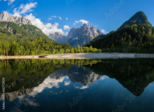 Lake Jasna from Kranjska region of north-west part of Slovenia country. Mountain chain of Julian Alps.