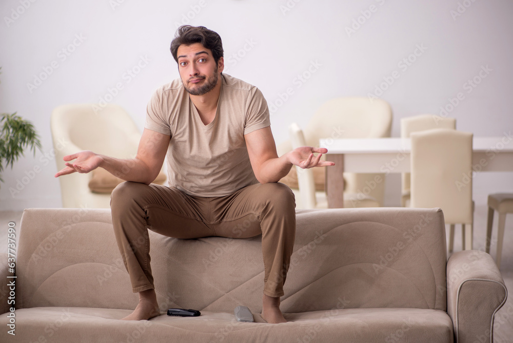 Young man sitting at home during pandemic Young man sitting at home during pandemic