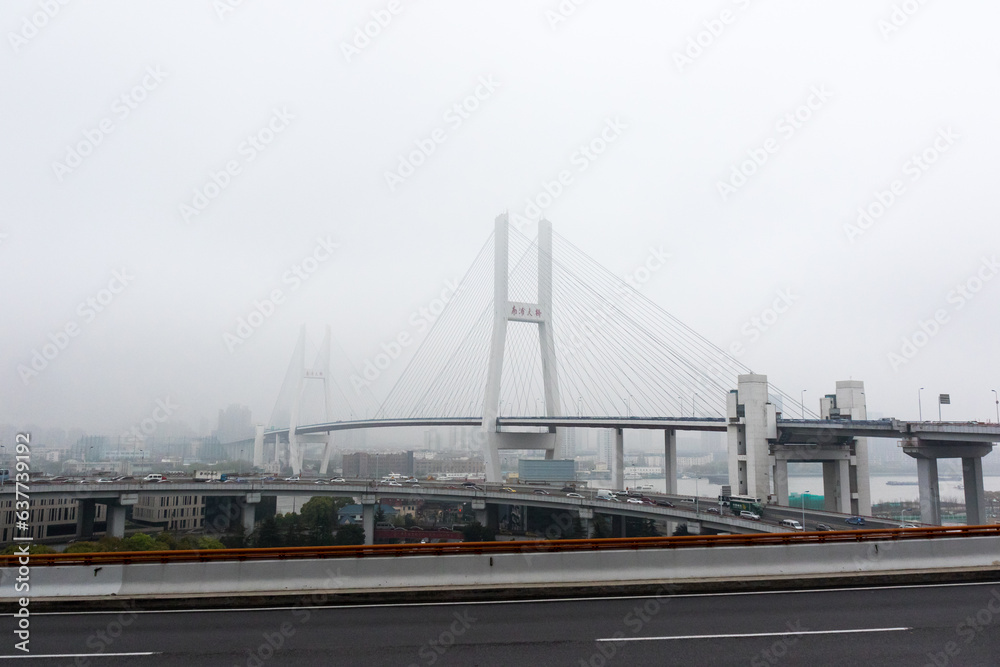 Foggy Nanpu Bridge with Empty Streets and Stunning Sky in Shanghai